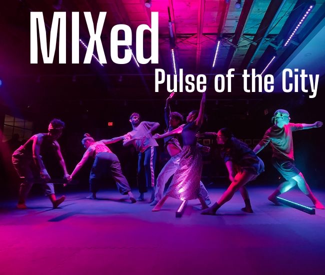 Dancers performing under colorful stage lighting for MIXed: Pulse of the City